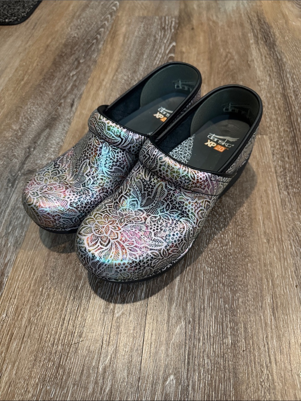 Dansko Iridescent Multicolor Floral Pattern Clogs with Black Trim
